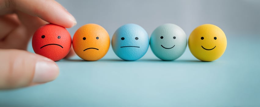 The playful display of emotions through colorful smiley face balls. photo