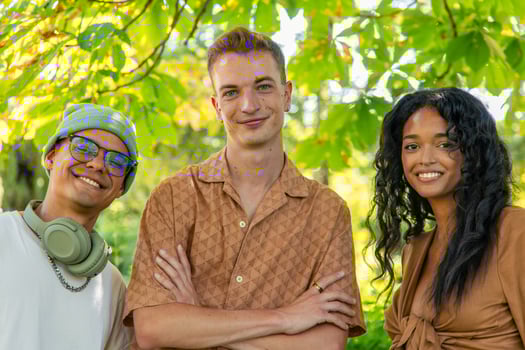 Multicultural Group of young friends enjoying a picnic in a park photo