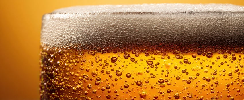The golden beverage with frothy bubbles and refreshing appeal. photo