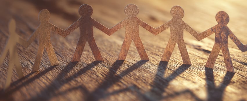 The wooden figures representing unity and collaboration among diverse individuals. photo