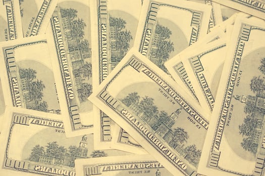 American dollars pile as background photo