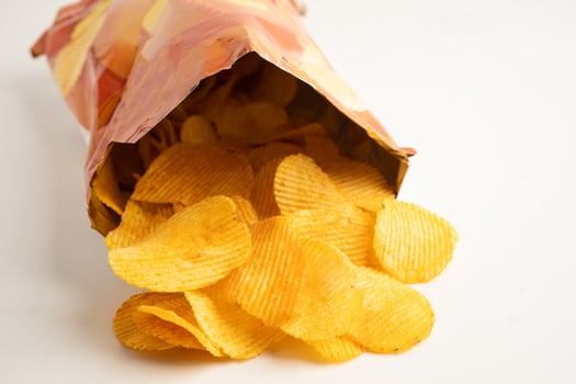 Potato chips delicious BBQ seasoning spicy for crips, thin slice deep photo