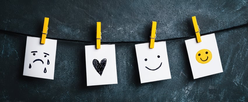 The collection of emotive illustrations displayed on a clothesline. photo