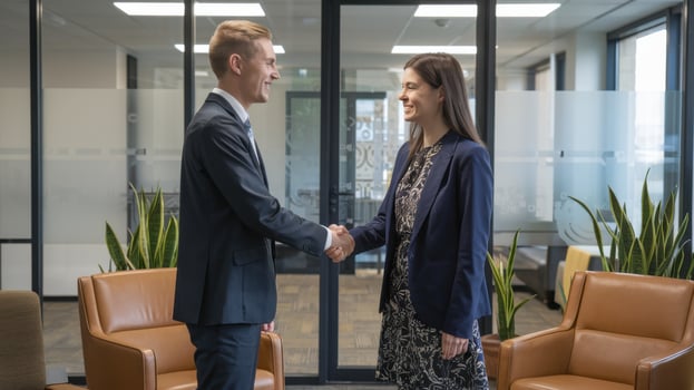 Business people shaking hands in a modern office environment. photo