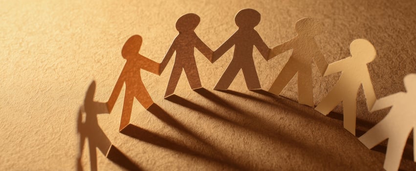 The paper figures holding hands showcasing togetherness and unity. photo