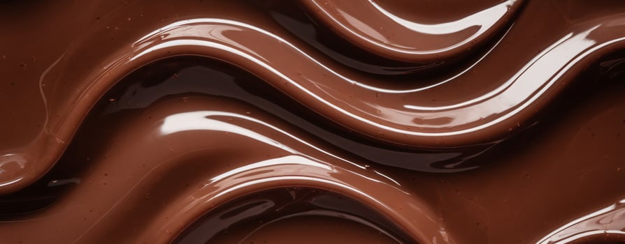 Smooth, glossy chocolate waves create a rich, indulgent texture perfect for dessert backgrounds. photo