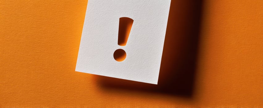 The Exclamation Mark Cutout on Vibrant Orange Background for Attention-Grabbing Design photo
