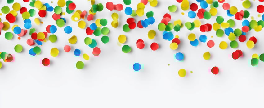 The colorful confetti scattered across a white background for festive celebrations. photo