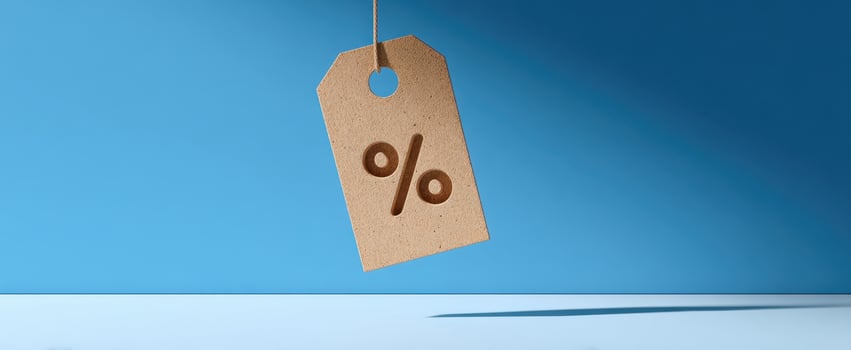 The percentage discount tag hanging against a vibrant blue background. photo
