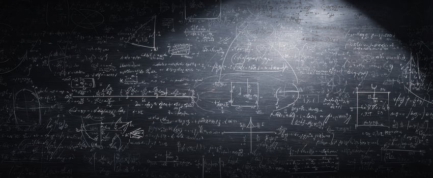 The chalkboard filled with complex mathematical equations and scientific formulas. photo