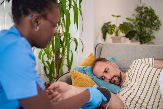 Nurse assisting patient at home in cozy living space photo