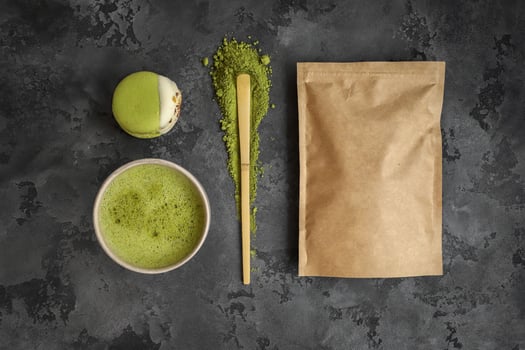 Green tea matcha in a bowl, bamboo whisk photo