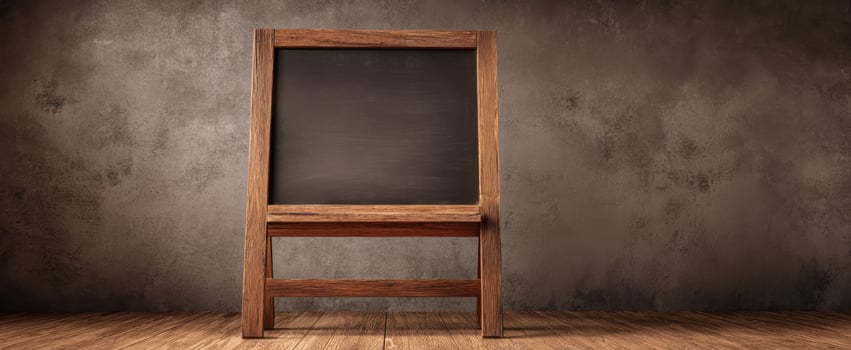 The wooden blackboard in a rustic setting ready for teaching or creativity. photo