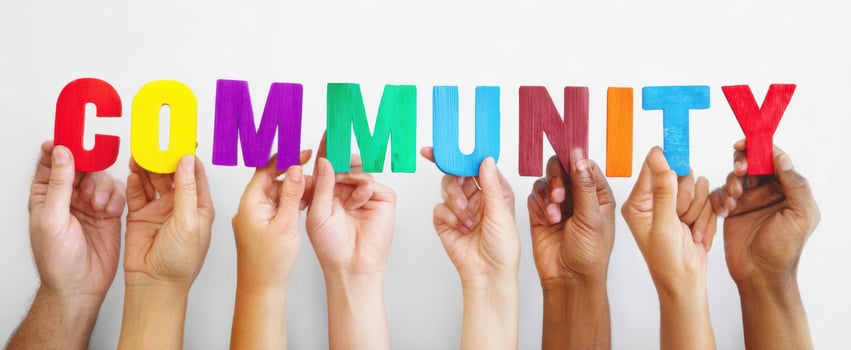 The Hands Holding Colorful Letters Spelling Community Together photo