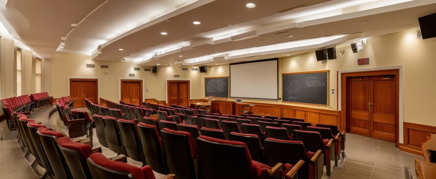 The modern auditorium featuring comfortable seating and high-tech presentation facilities. photo