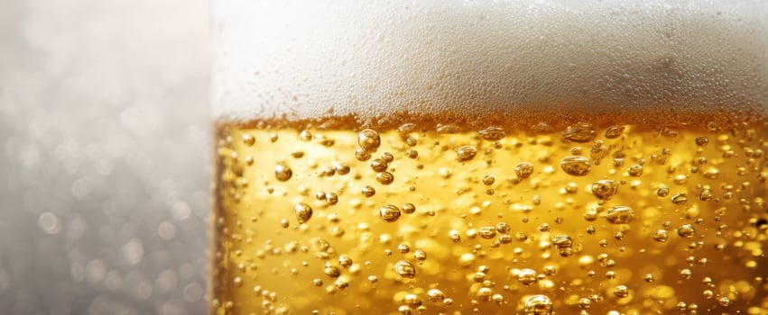 The refreshing golden beer with frothy foam and bubbles sparkling. photo
