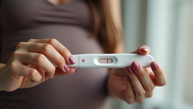 Flat Young woman holding pregnancy test in hand depicting pregnancy confirmation and emotional moment in personal setting concept as Young woman holding pregnancy test in hand dep Act 4 photo
