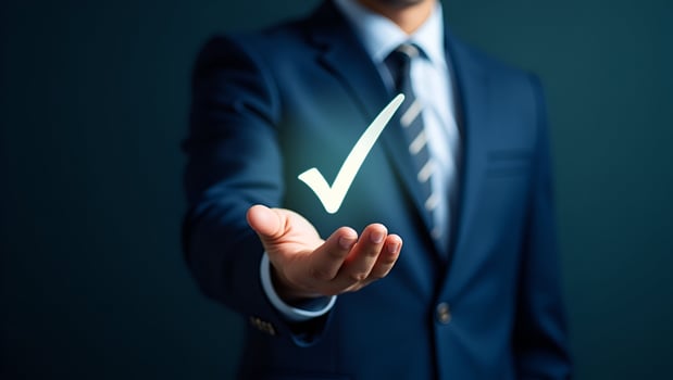 Flat Businessman holding holographic digital check mark icon symbolizing standard quality control certification assurance guarantee for automation process in empty space concept as Act 7 photo