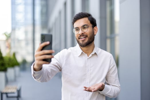 Man video calling in a city photo