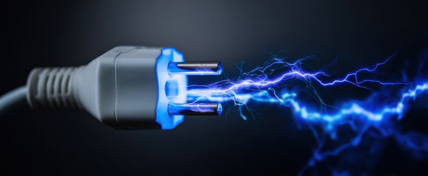 The High-Voltage Plug Emitting Electric Sparks Against a Dark Background photo
