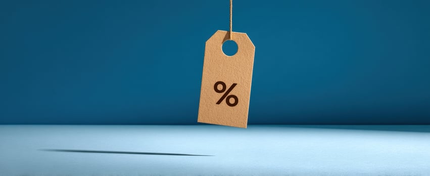 The hanging discount tag with percentage symbol against a blue background. photo
