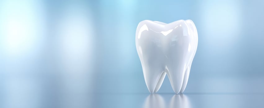 The Glossy White Tooth on a Bright Background Representing Dental Health and Care photo