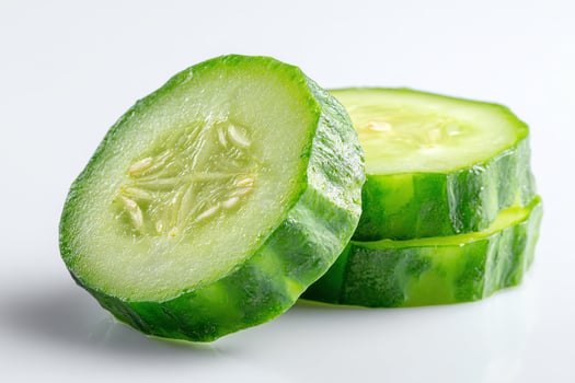 Fresh cucumber slices on a white background. photo