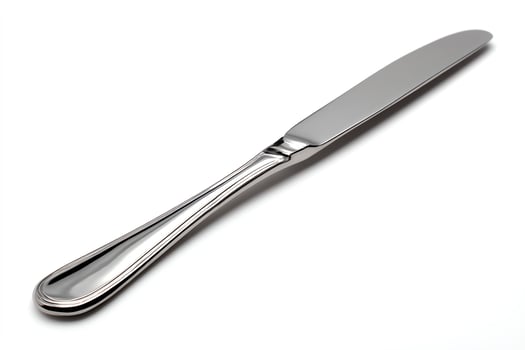 Stainless steel butter knife on a white background. photo