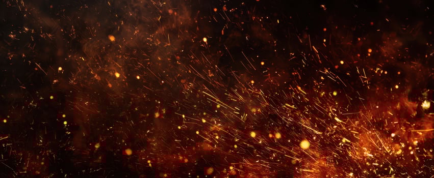 The sparks and embers dancing in a fiery and dramatic background. photo