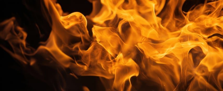 The Captivating Beauty of Flames Dancing in the Dark photo