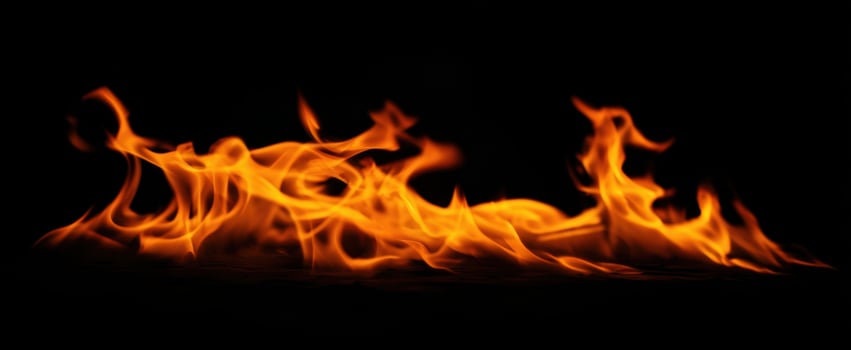 The Dance of Flames Against a Dark Background photo
