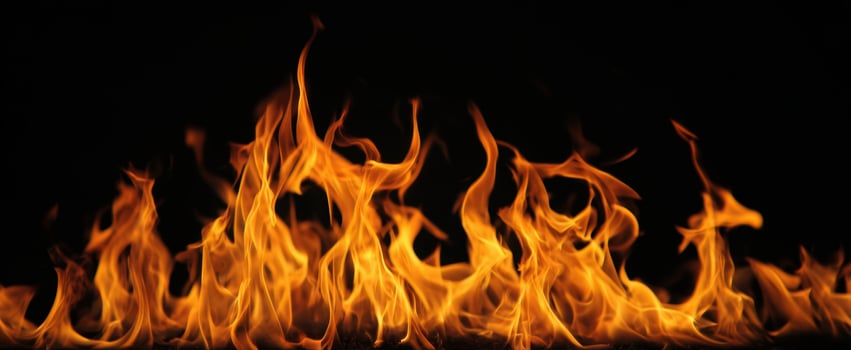 The captivating dance of flames against a dark background. photo