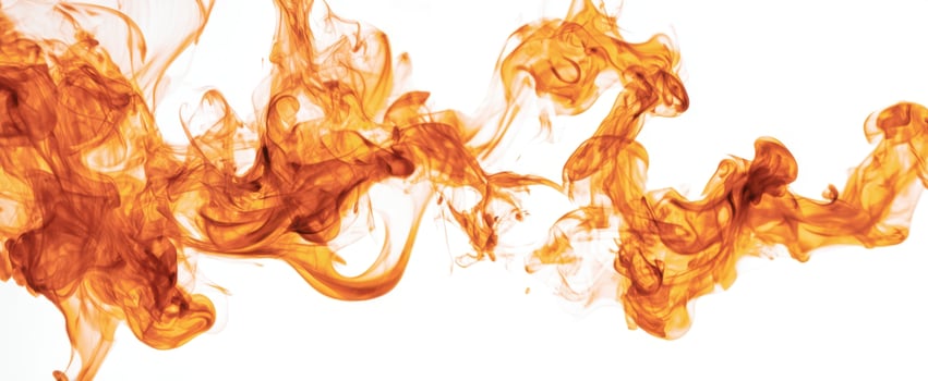 The mesmerizing dance of orange flames against a white backdrop. photo