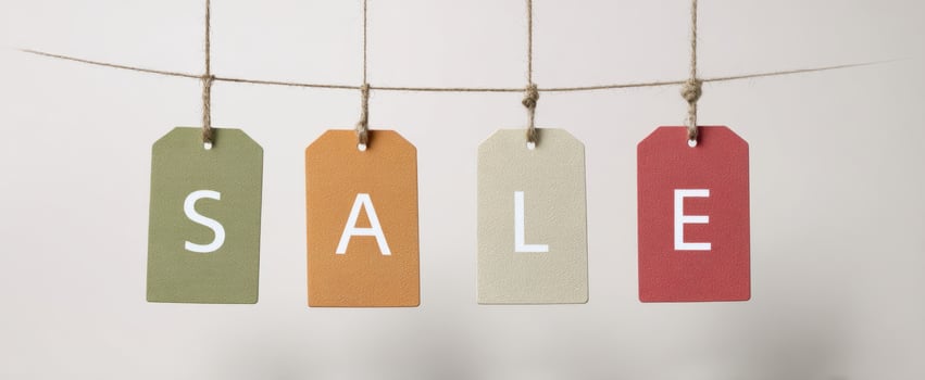 The sale tags hanging on twine for a vibrant shopping promotion. photo