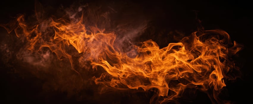 The vibrant flames dance against a dark background in captivating motion. photo