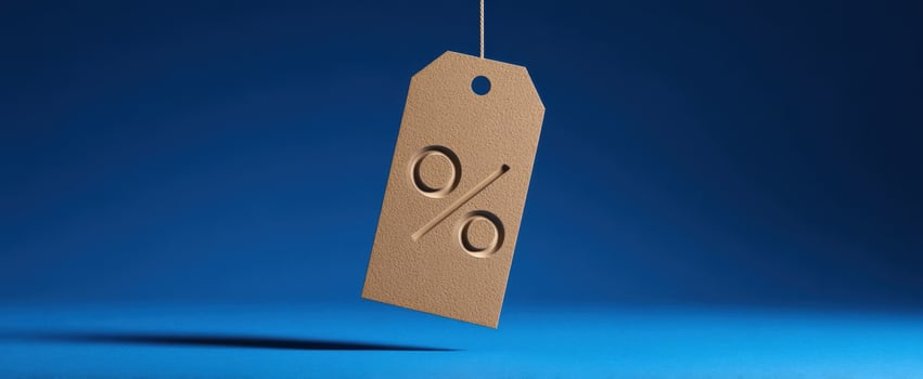 The discount tag showcasing a percentage symbol against a stunning blue backdrop. photo
