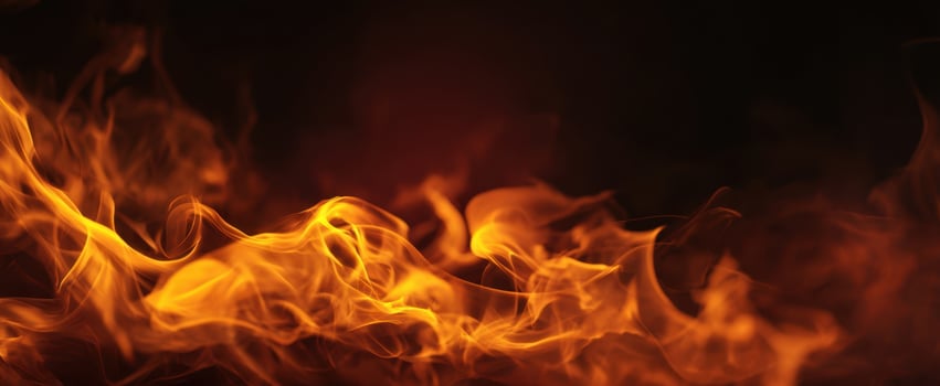 The captivating dance of flames in a dark background. photo