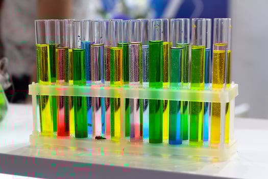 Laboratory glassware with solutions of different colors photo
