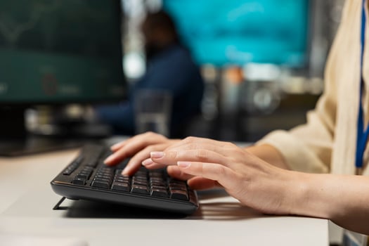 Close up of female worker leverages analytics and report writing for development and monthly performance results, utilizing digital resources and insights to ensure strategic goals achievement. photo