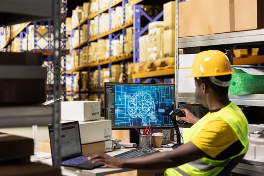 Employee uses AI brain automation to scan airway bill details on tags, registering barcodes with artificial intelligence machine learning system to fulfill e-commerce retail operations. photo