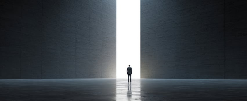 The lone figure in a suit standing before a towering vertical shaft of light photo