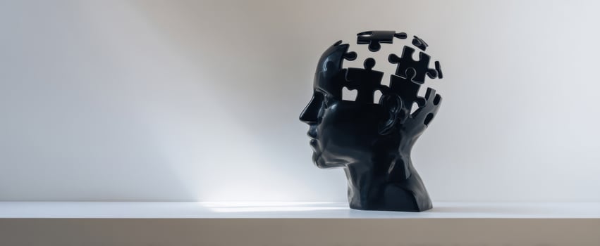 The Black Puzzle-Piece Head Sculpture Symbolizing Mind Memory Mental Health And Creative Thinking photo