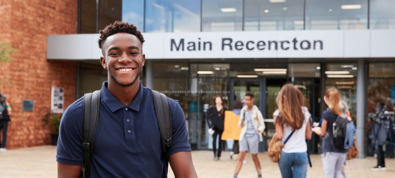 The Student Smiling with Backpack Outside a Modern University Main Reception Entrance photo