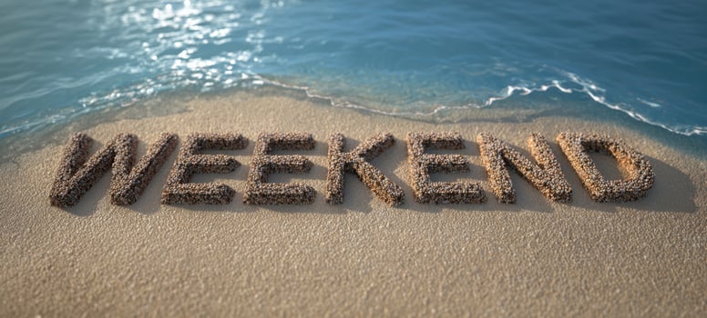 The Weekend text made of shells on a sunny sandy beach shoreline photo