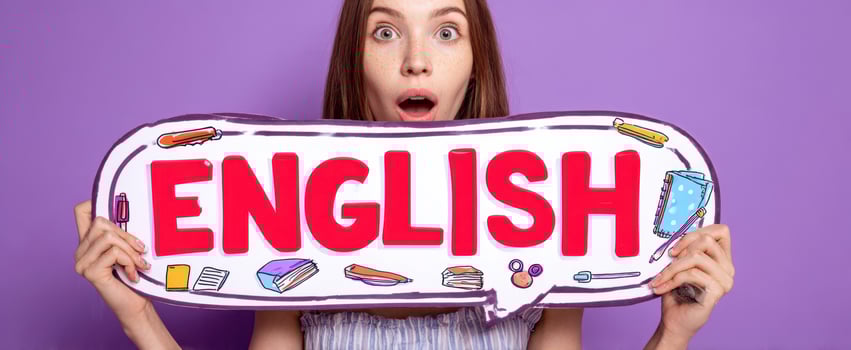 The English Sign Held by an Excited Young Woman Promoting Language Learning photo