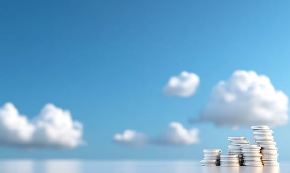 Coins growing under blue sky. Financial success concept photo