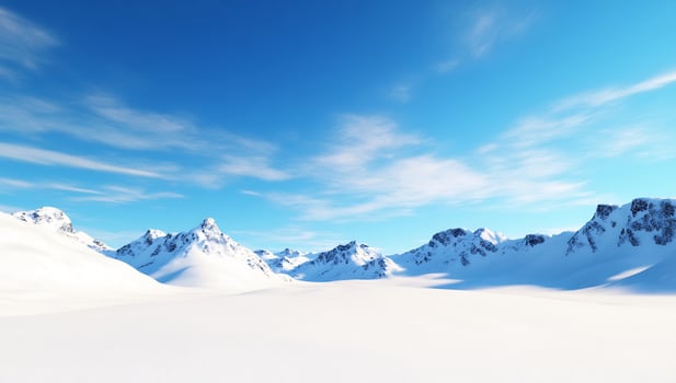 Snowy mountain range under a bright blue sky. Winter landscape, perfect for travel brochures photo