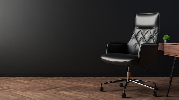 Modern black leather office chair, dark room, wooden floor, desk photo