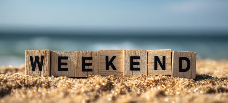 The Weekend Wooden Blocks on Sandy Beach with Ocean Horizon Background photo