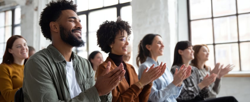 The Audience Applauding in a Bright Modern Workshop or Seminar Setting photo